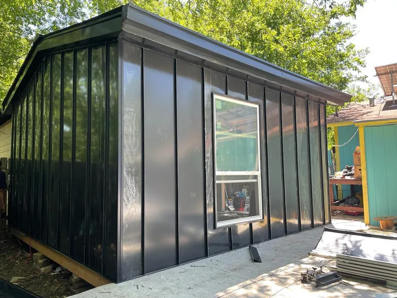 Black standing seam metal wall panels for Roof Inspection in Orem