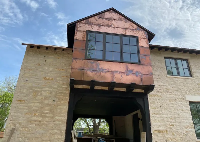 Copper metal panel facade on a stone building for Metal Roof Coating in Orem